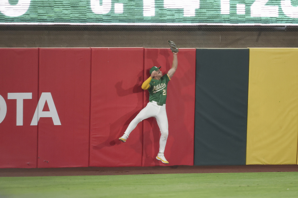 Athletics outfielder Tyler Soderstrom catches a ball hit by Texas Rangers' Michael Helman, not shown, during the ninth inning of a baseball game Friday, Aug. 29, 2025, in West Sacramento, Calif. (AP Photo/Sara Nevis)