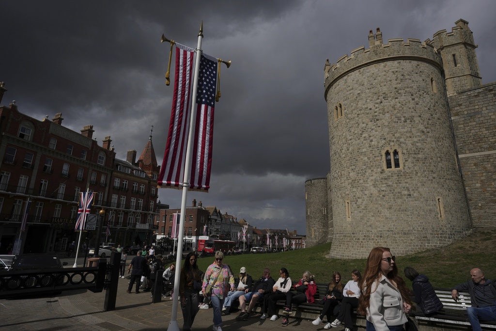 U.S. flag and Union flag are hanged outside the Windsor Castle ahead of the state visit by U.S. President Donald Trump next week in Windsor, England, Friday, Sept. 12, 2025. (AP Photo/Kin Cheung)
