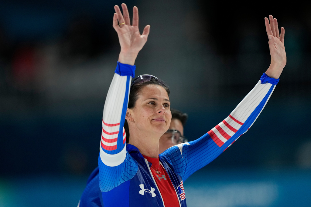 Fourth placed Brittany Bowe of the U.S. and her coach Ryan Shimabukuro, rear, react after the women's 1500 meters speedskating race at the 2026 Winter Olympics, in Milan, Italy, Friday, Feb. 20, 2026. (AP Photo/Ben Curtis)