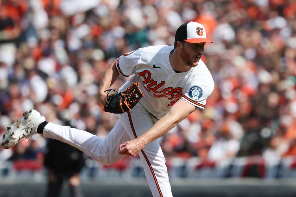 Baltimore Orioles pitcher Trevor Rogers throws during the first inning of an opening-day baseball game against the Minnesota Twins, Thursday, March. 26, 2026, in Baltimore. (AP Photo/Terrance Williams)