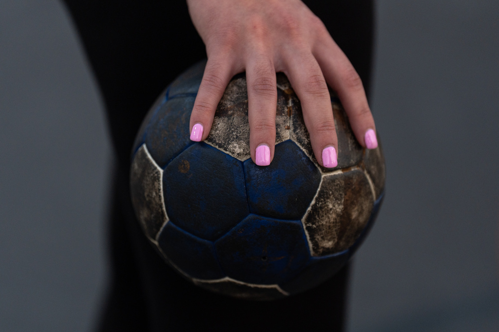 Gabrielle Morales holds a resin-covered handball during a handball training session in Tustin, Calif., Wednesday, March 25, 2026. (AP Photo/Jae C. Hong)