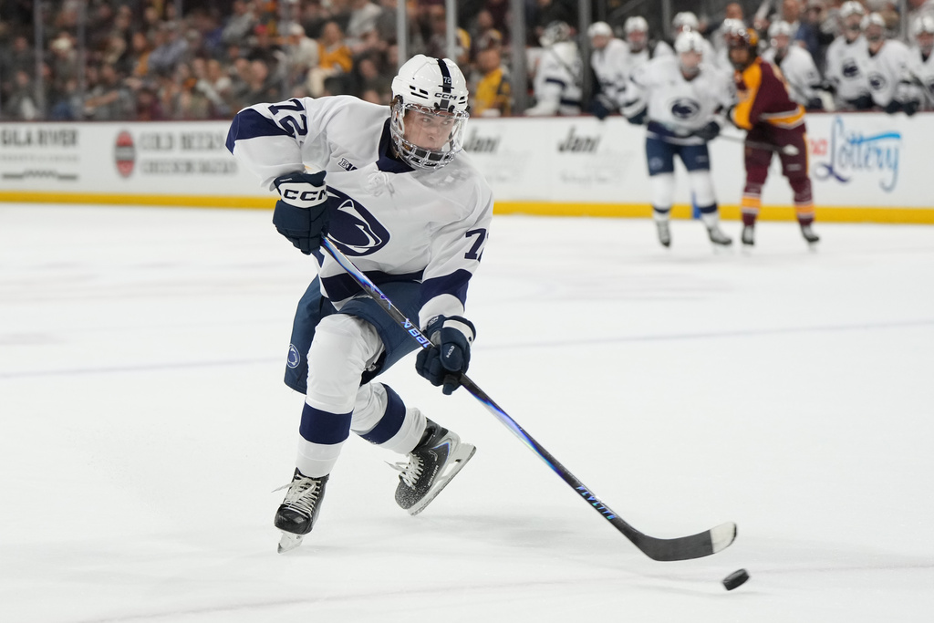 Penn State's Gavin McKenna shoots against Arizona State during the first period of an NCAA college hockey game, Friday, Oct. 3, 2025, in Tempe, Ariz. (AP Photo/Rick Scuteri)