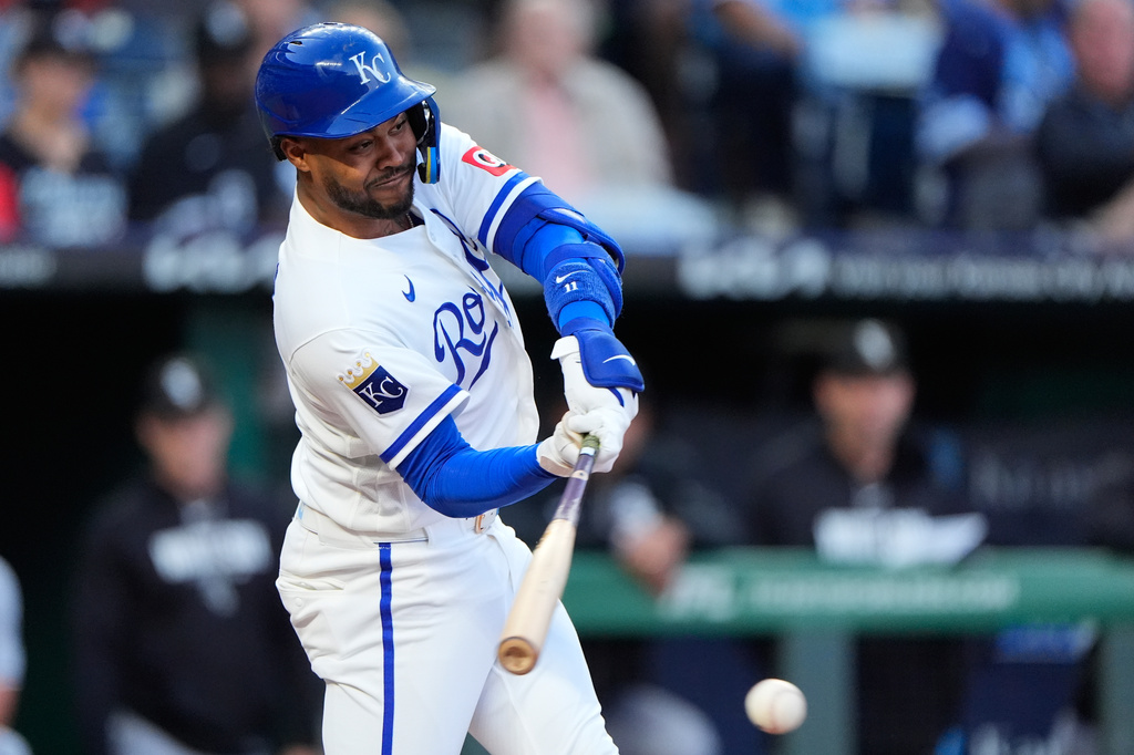 Kansas City Royals' Maikel Garcia hits a two-run single during the first inning of a baseball game against the Chicago White Sox, Wednesday, Sept. 23, 2026, in Kansas City, Mo. (AP Photo/Charlie Riedel)