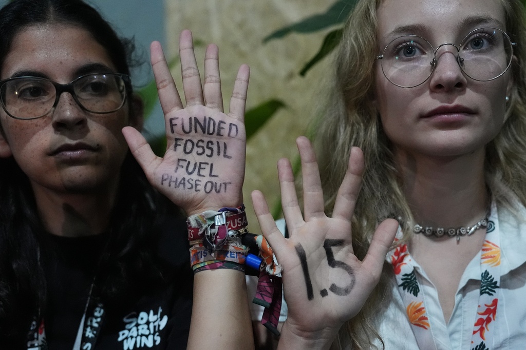 Activists participate in a demonstration outside where negotiations are taking place at the COP30 U.N. Climate Summit, Friday, Nov. 21, 2025, in Belem, Brazil. (AP Photo/Joshua A. Bickel)
