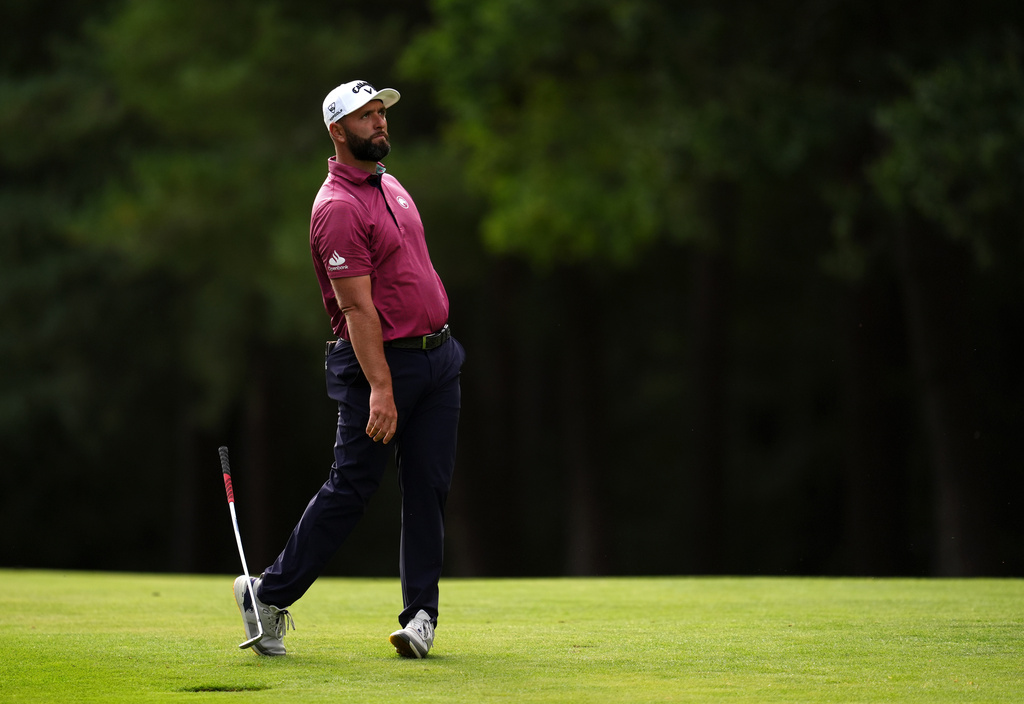 Jon Rahm of Spain drops his club on the 13th hole during the first round of the BMW Championship golf tournament in Virginia Water, England, Thursday Sept. 17, 2026. (Adam Davy/PA via AP)