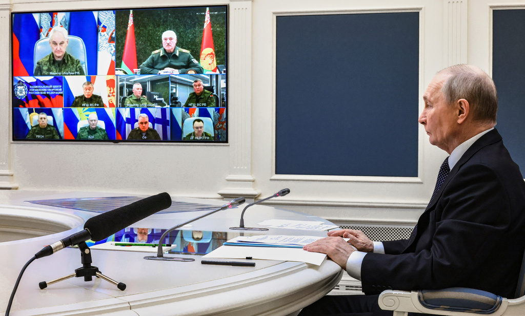 Russian President Vladimir Putin and his Belarusian counterpart Alexander Lukashenko take part in a video call as part of joint nuclear drills at the Presidential Situation Centre at the Kremlin in Moscow, Thursday, May 21, 2026. (Mikhail Metzel/Sputnik, Kremlin Pool Photo via AP)