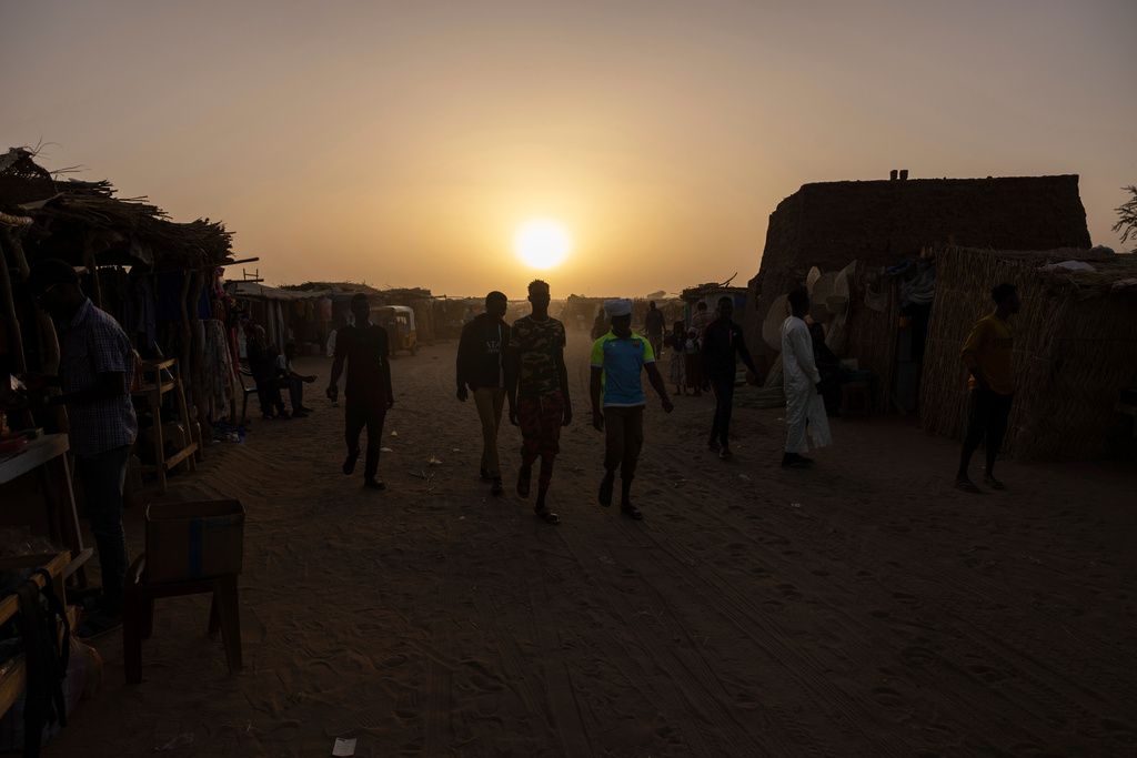 FILE - Night falls on the Adre, Chad, transit camp on May 6, 2025. (AP Photo/Caitlin Kelly, File)
