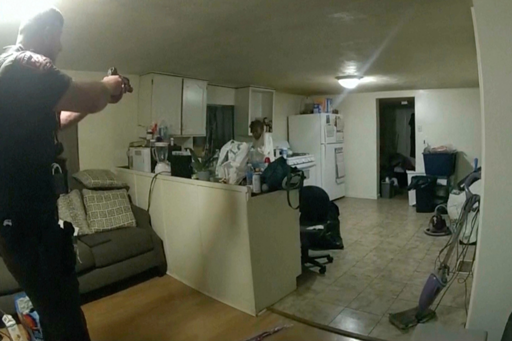 FILE - In this image from body camera video released by Illinois State Police, Sangamon County Sheriff's Deputy Sean Grayson, left, points his gun at Sonya Massey, who called 911 for help, before shooting and killing her inside her home in Springfield, Ill., July 6, 2024. (Illinois State Police via AP, File)