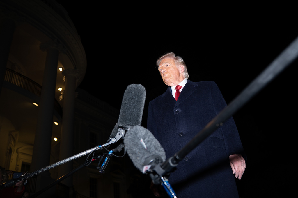 President Donald Trump talks to reporters as he departs the White House, Friday, Oct. 24, 2025, in Washington, for a trip to Asia. (AP Photo/Allison Robbert)