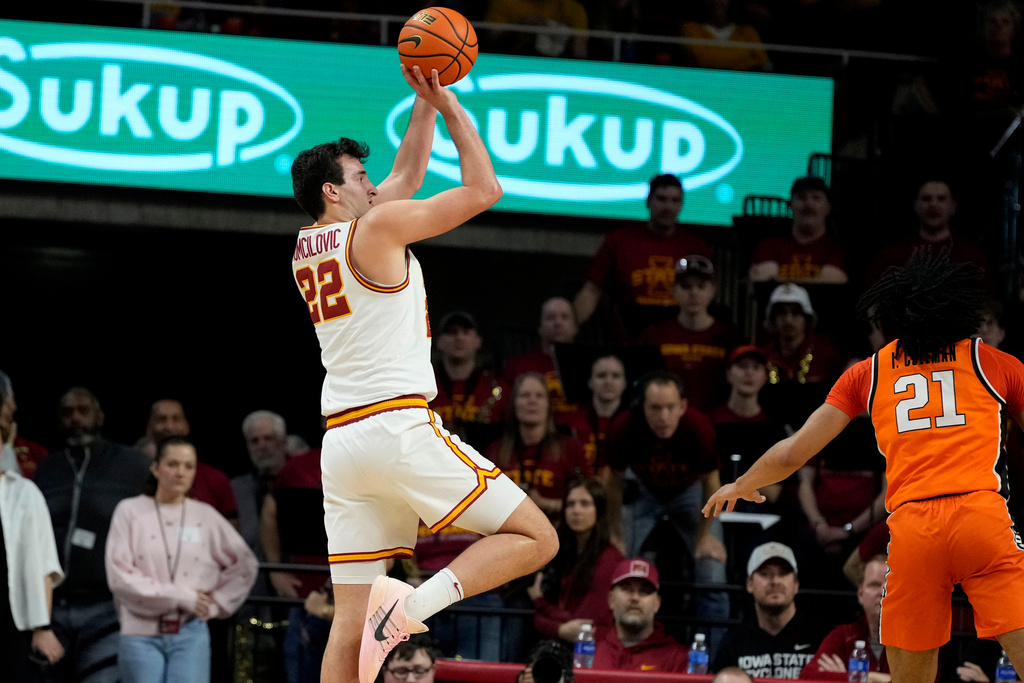 Iowa State forward Milan Momcilovic (22) shoots over Oklahoma State guard Isaiah Coleman (21) during the first half of an NCAA college basketball game, Saturday, Jan. 10, 2026, in Ames, Iowa. (AP Photo/Charlie Neibergall)