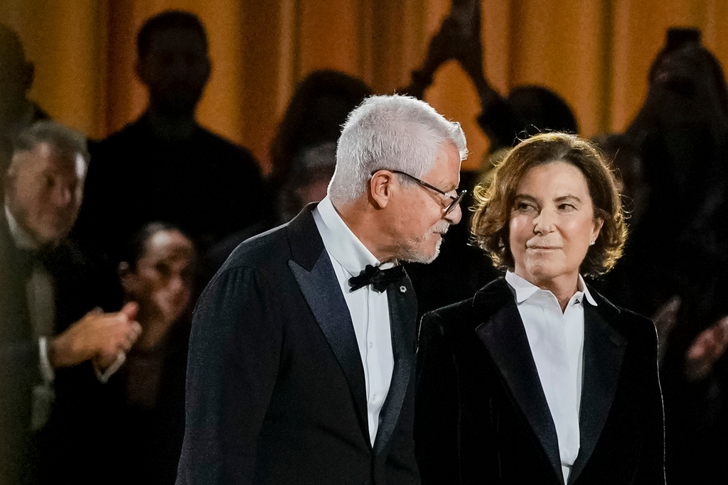 Leo Dell'Orco, left, and Silvana Armani acknowledge the applause at the end of the Giorgio Armani Spring/Summer 2026 collection show in Milan, Italy, Sunday, Sept. 28, 2025. (AP Photo/Luca Bruno)