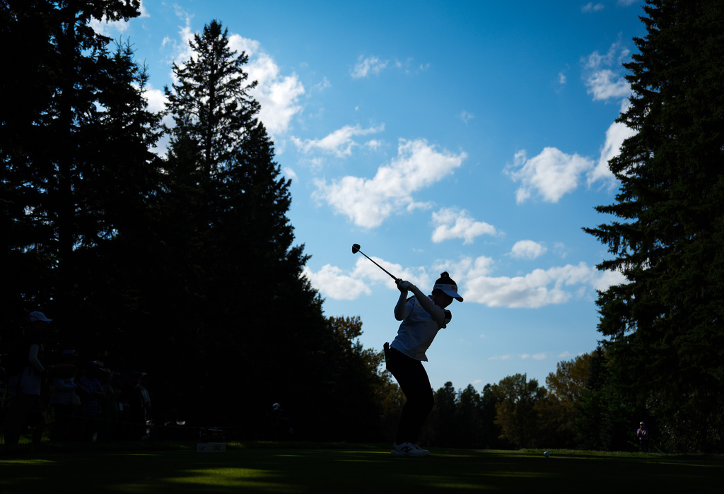 Miyu Yamashita, of Japan, hits her tee shot on the 12th hole during the second round at the LPGA Canadian Women's Open golf tournament in Edmonton, Alberta, Friday, Aug. 21, 2026. (Darryl Dyck/The Canadian Press via AP)