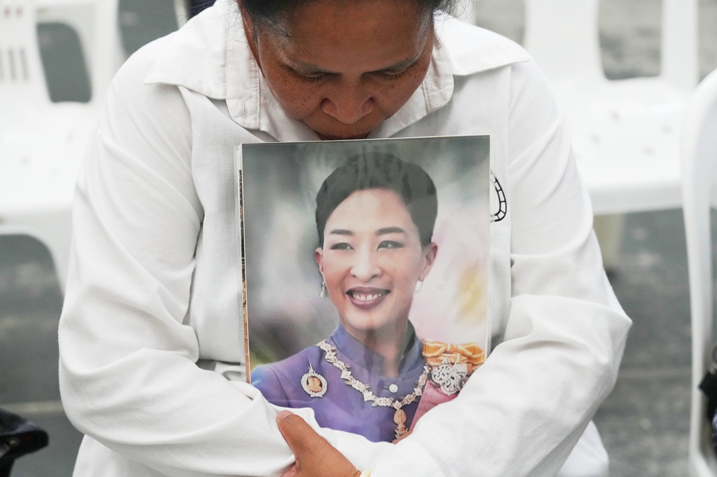 A person holds a picture of the late Thailand Princess Bajrakitiyabha Mahidol in Bangkok, Thailand, Friday, June 12, 2026. (AP Photo/Sakchai Lalit)