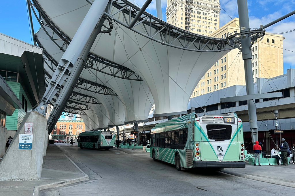 Buses pick up passengers at the Rosa Parks Transit Center in Detroit, Wednesday, Oct. 29, 2025. (AP Photo/Ed White)