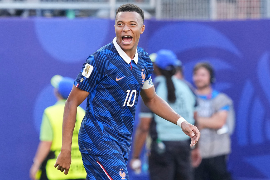 France's Kylian Mbappe (10) celebrates after scoring from a penalty kick the opening goal during the World Cup round of 16 soccer match between Paraguay and France in Philadelphia, Saturday, July 4, 2026. (AP Photo/Martin Meissner)