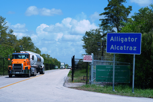 FILE - Trucks come and go from the "Alligator Alcatraz" immigration detention center in the Florida Everglades, Thursday, Aug. 28, 2025, in Collier County, Fla. (AP Photo/Rebecca Blackwell, File) FILE - Trucks come and go from the "Alligator Alcatraz" immigration detention center in the Florida Everglades, Thursday, Aug. 28, 2025, in Collier County, Fla. (AP Photo/Rebecca Blackwell, File)
