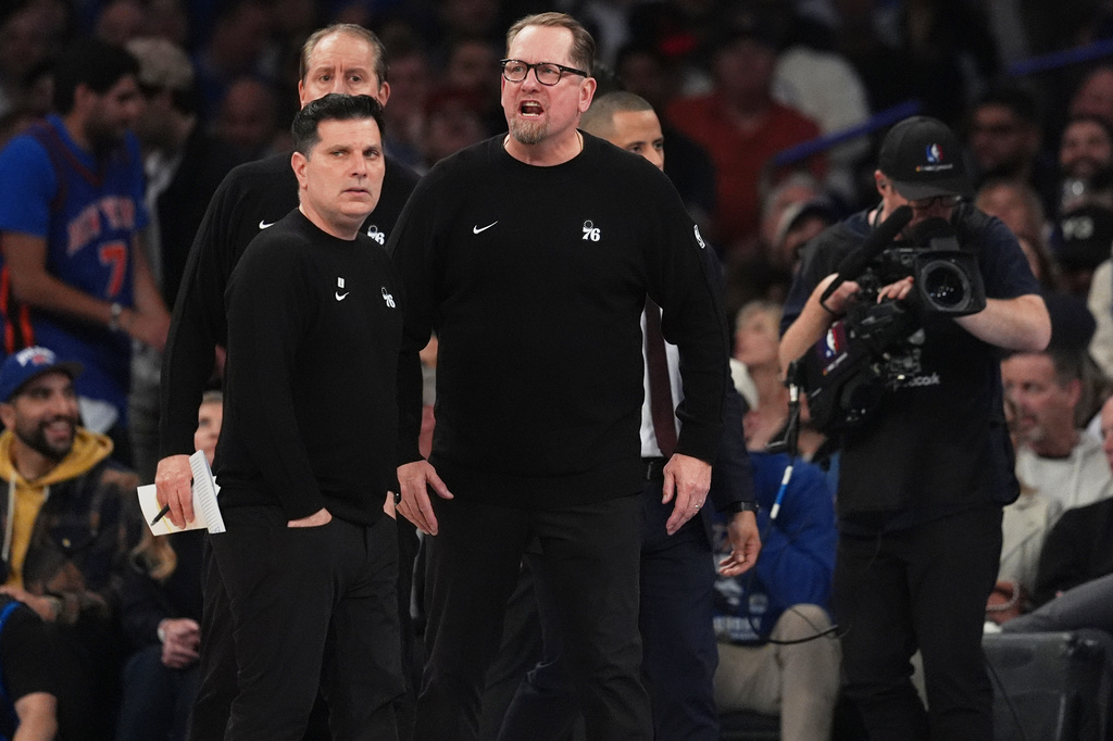 Philadelphia 76ers' Nick Nurse, center, yells during a time out during the second half of Game 1 in a second-round NBA basketball playoffs series against the New York Knicks Monday, May 4, 2026, in New York. (AP Photo/Seth Wenig)