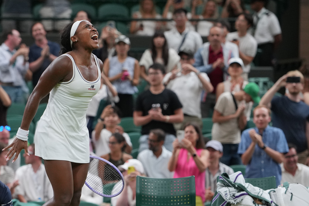Coco Gauff of the United States reacts after winning against Belinda Bencic of Switzerland in their fourth round women's singles match at the Wimbledon Tennis Championships in London, Sunday, July 5, 2026. (AP Photo/Kin Cheung)