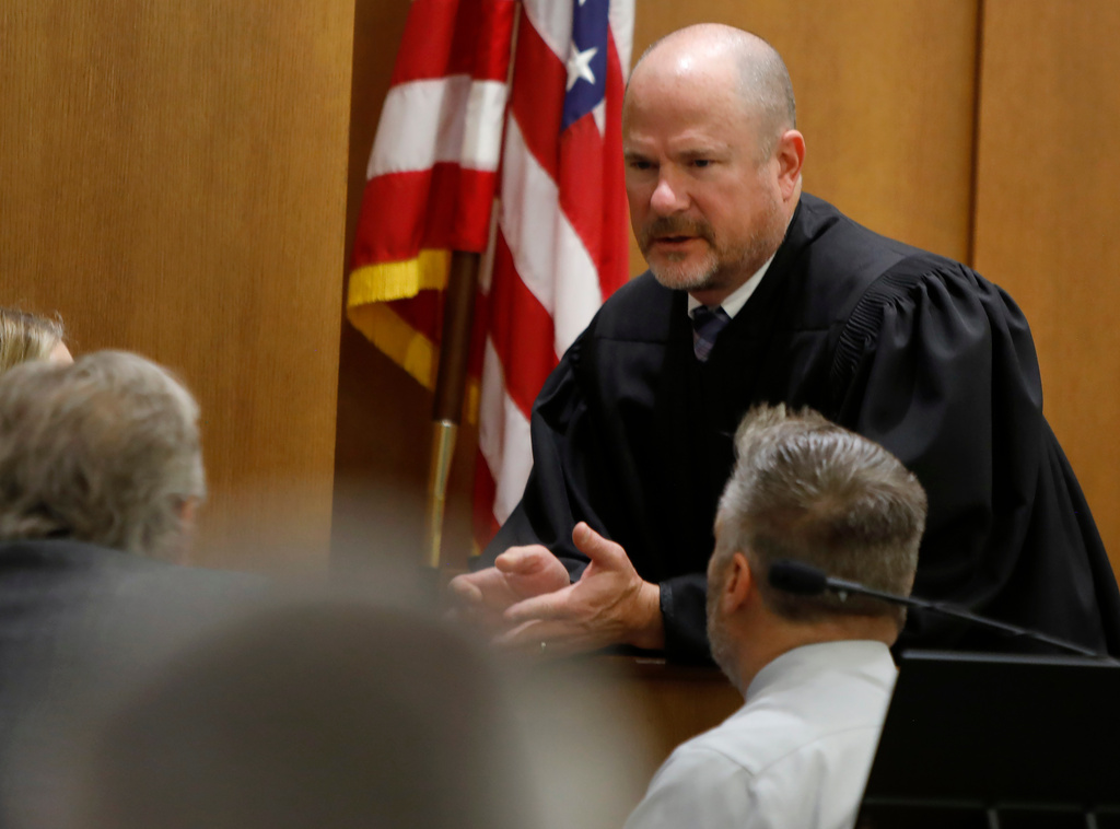 Newport News Circuit Court Judge Matthew Hoffman sidebars with attorneys during Former Richneck Elementary School teacher Abby Zwerner's civil lawsuit against the former assistant principal of the school where Zwerner was shot, Tuesday, Oct. 28, 2025, in Newport News, Va. (Stephen M. Katz/The Virginian-Pilot via AP, Pool)