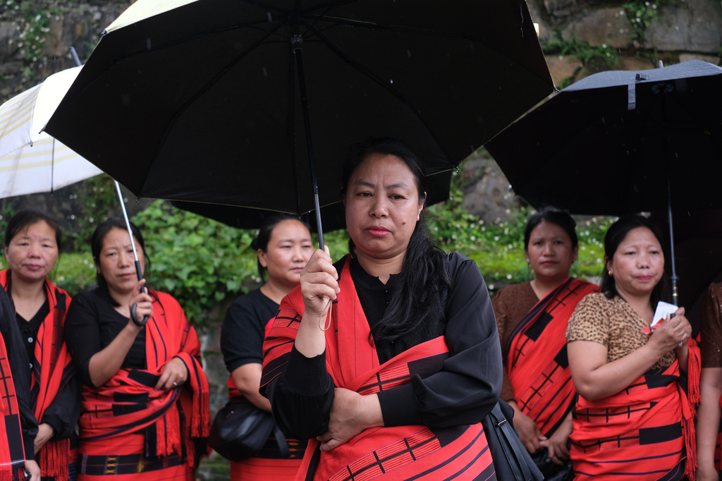 Sanglishe Yimkhiung, 45, participates in a protest against rising cases of sexual violence against women and demanding justice for victims, in Kohima, capital of the northeastern Indian state of Nagaland, Friday, June 19, 2026. (AP Photo/Yirmiyan Arthur)