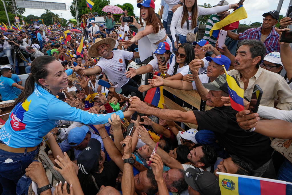 FILE - Opposition leader Maria Corina Machado greets supporters during a campaign rally for presidential candidate Edmundo Gonzalez, in Maturin, Venezuela, Saturday, July 20, 2024. (AP Photo/Matias Delacroix, File)