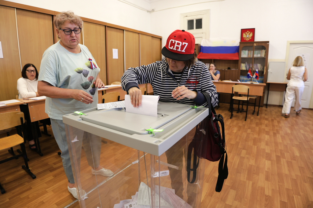 A voter casts a ballot in the parliamentary election in Vladivostok, Russia, Friday, Sept. 18, 2026. (AP Photo)