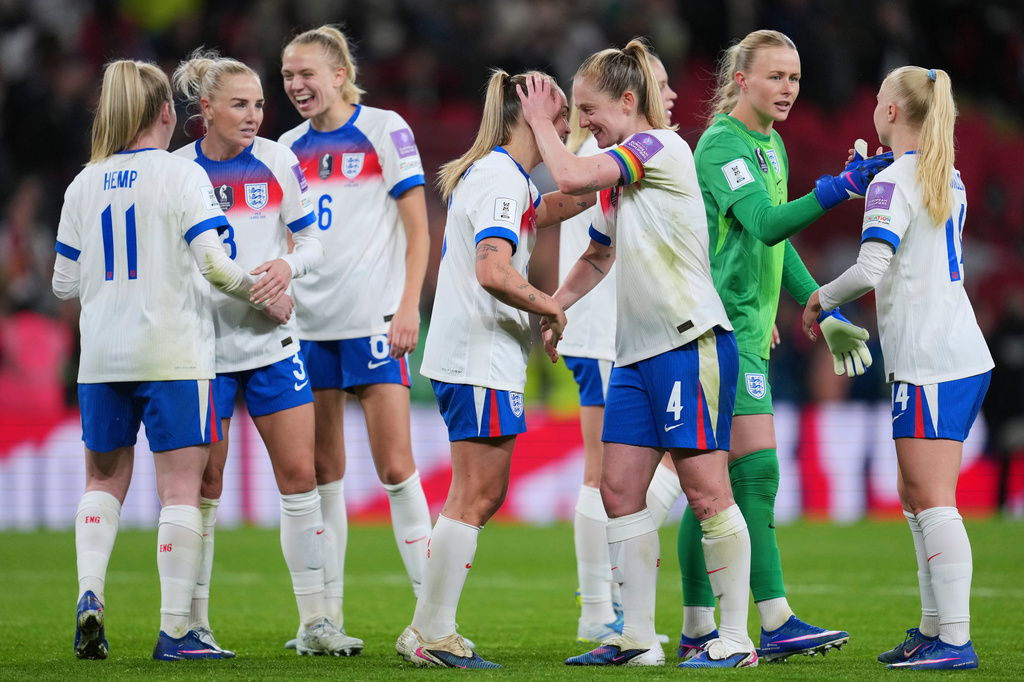 England players celebrate after the Women's 2027 World Cup group C qualifier soccer match between England and Spain in London, Tuesday, April 14, 2026. (AP Photo/Kin Cheung)