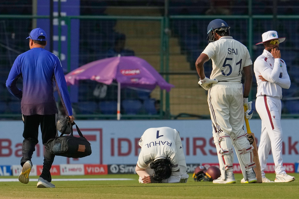 India's KL Rahul sits on the ground after West Indies' Jayden Seales delivery hits him on the fourth day of the second cricket test match between India and West Indies at the Arun Jaitley Stadium in New Delhi, India, Monday, Oct.13, 2025. (AP Photo/Manish Swarup)