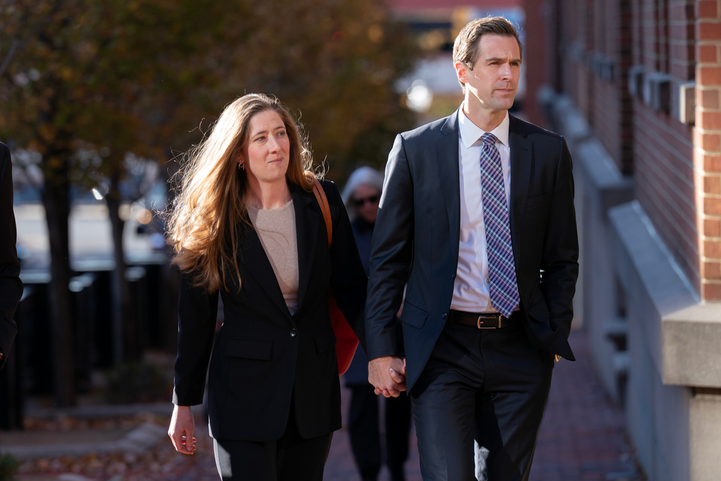 Kate Comey daughter of former FBI Director James Comey, and Troy Edwards, Jr., arrive at federal courthouse in Alexandria, Va., Thursday, Nov. 13, 2025. (AP Photo/Jose Luis Magana)