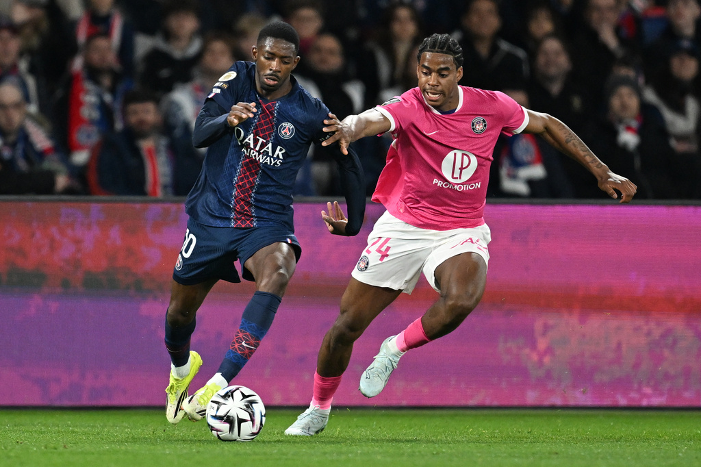 PSG's Ousmane Dembele, left, and Toulouse's Dayann Methalie fight for the ball during a League One soccer match between Paris Saint-Germain and Toulouse in Paris, France, Friday, April 3, 2026. (AP Photo/Emma Da Silva)
