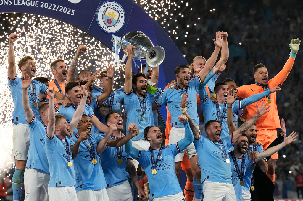 FILE - Manchester City's Ilkay Gundogan holds up the trophy after winning the Champions League final soccer match between Manchester City and Inter Milan at the Ataturk Olympic Stadium in Istanbul, Turkey, Sunday, June 11, 2023. (AP Photo/Antonio Calanni, File)