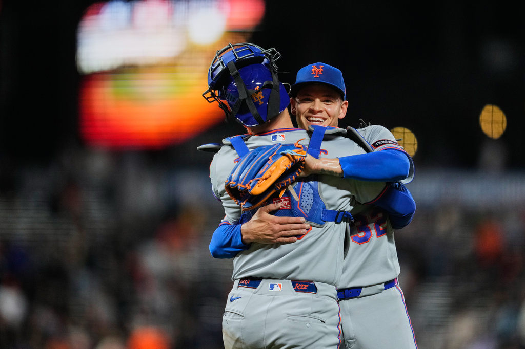 New York Mets pitcher Tobias Myers, right, and catcher Luis Torrens celebrate after the team's victory over the San Francisco Giants in a baseball game Saturday, April 4, 2026, in San Francisco. (AP Photo/Godofredo A. Vásquez)