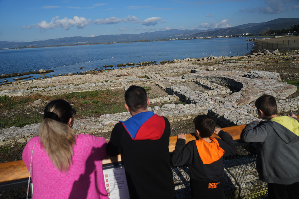 Visitors look at archaeological excavations of the ancient Byzantine-era Christian Saint Neophytos Basilica, in Iznik, also known by its ancient name Nicaea, northwestern Turkey, Thursday, Nov. 13, 2025, ahead of the visit of Pope Leo XIV to mark the 1,700th anniversary of the First Council of Nicaea. (AP Photo/Francisco Seco)
