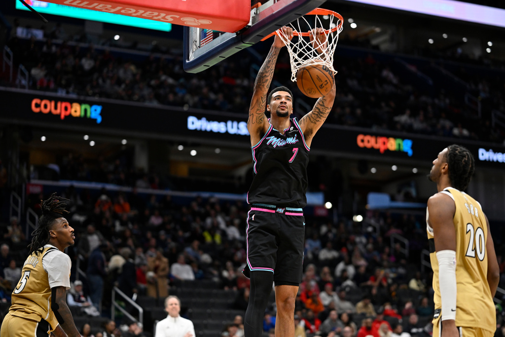 Miami Heat center Kel'el Ware (7) dunks during the second half of an NBA basketball game against the Washington Wizards, Sunday, Feb. 8, 2026, in Washington. (AP Photo/John McDonnell)