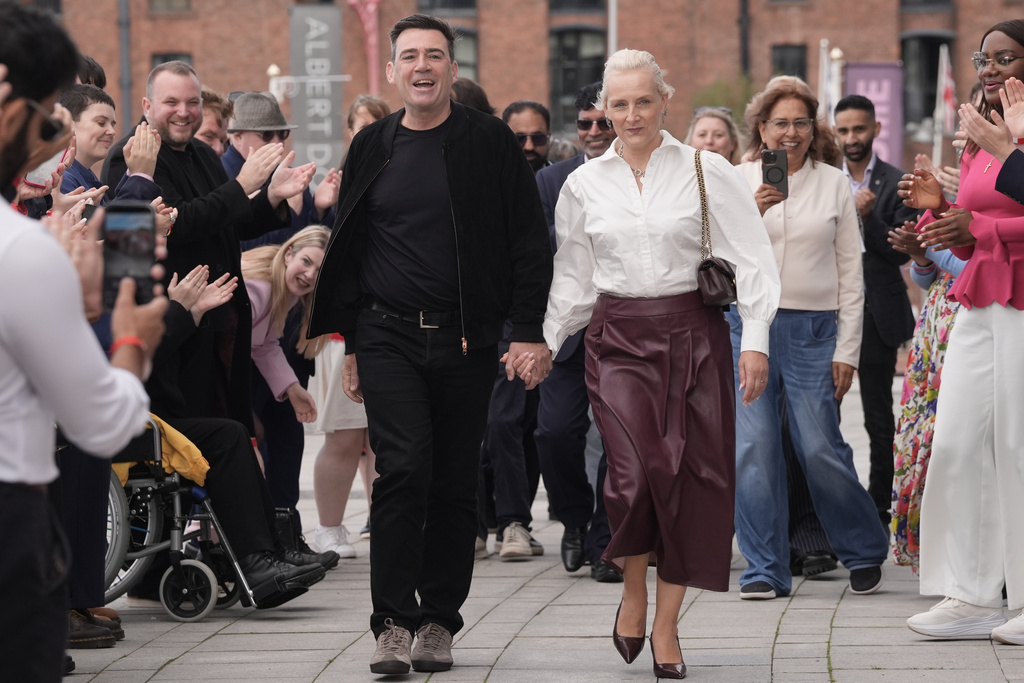 Britain's Prime Minister Andy Burnham and his wife Marie-France Van Heel arrive for the Labour Party Conference at the ACC Liverpool, in Liverpool, England,, Saturday, Sept. 26, 2026. (Stefan Rousseau/PA via AP)