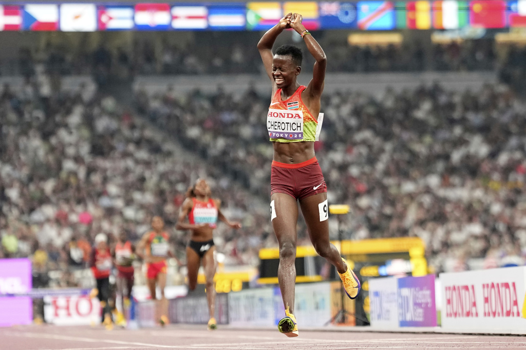 Kenya's Faith Cherotich celebrates after taking gold in the women's 3,000 meters steeplechase final at the World Athletics Championships in Tokyo, Wednesday, Sept. 17, 2025. (AP Photo/Petr David Josek)