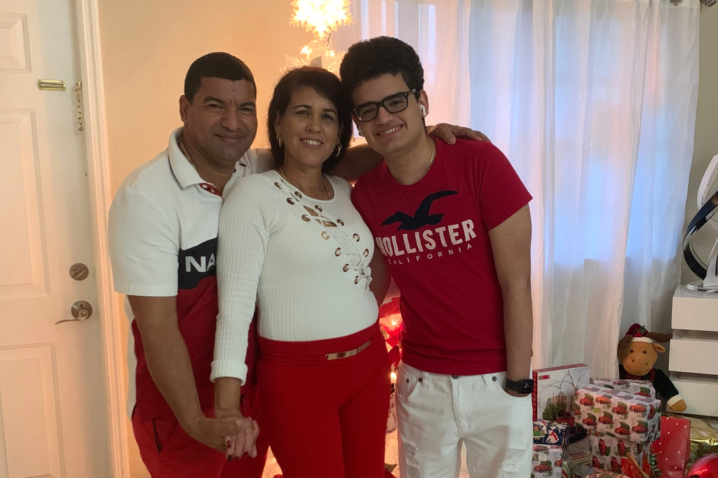 This undated photo provided by the family of Yoel Rodriguez Naranjo via Morgan & Morgan on Wednesday, Sept. 9, 2026, shows Naranjo, left, with his wife and son. (Family/Morgan & Morgan via AP)