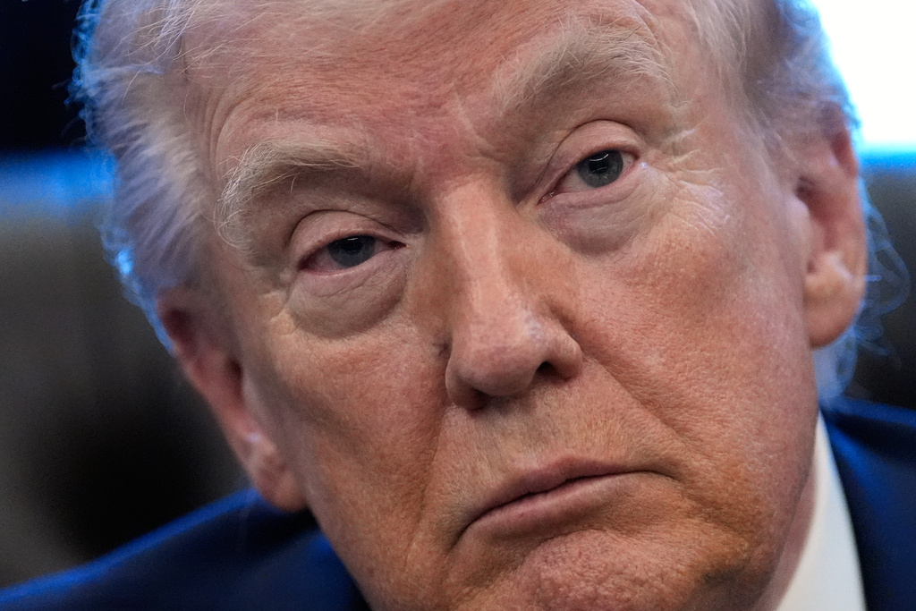 President Donald Trump listens to a question from a reporter as he speaks in the Oval Office of the White House, Monday, Feb. 2, 2026, in Washington. (AP Photo/Alex Brandon)