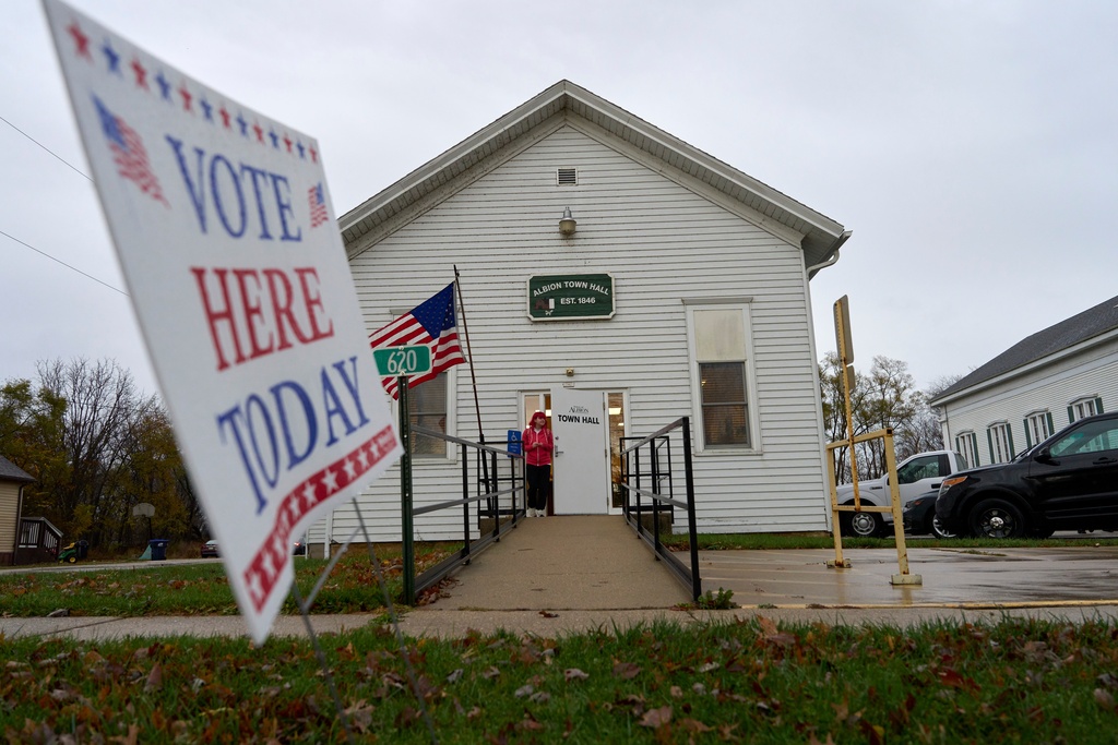 FILE - A voter leaves Albion Town hall after casting their ballot on Election Day, Nov. 5, 2024, in Albion, Wis. (AP Photo/Kayla Wolf, File)