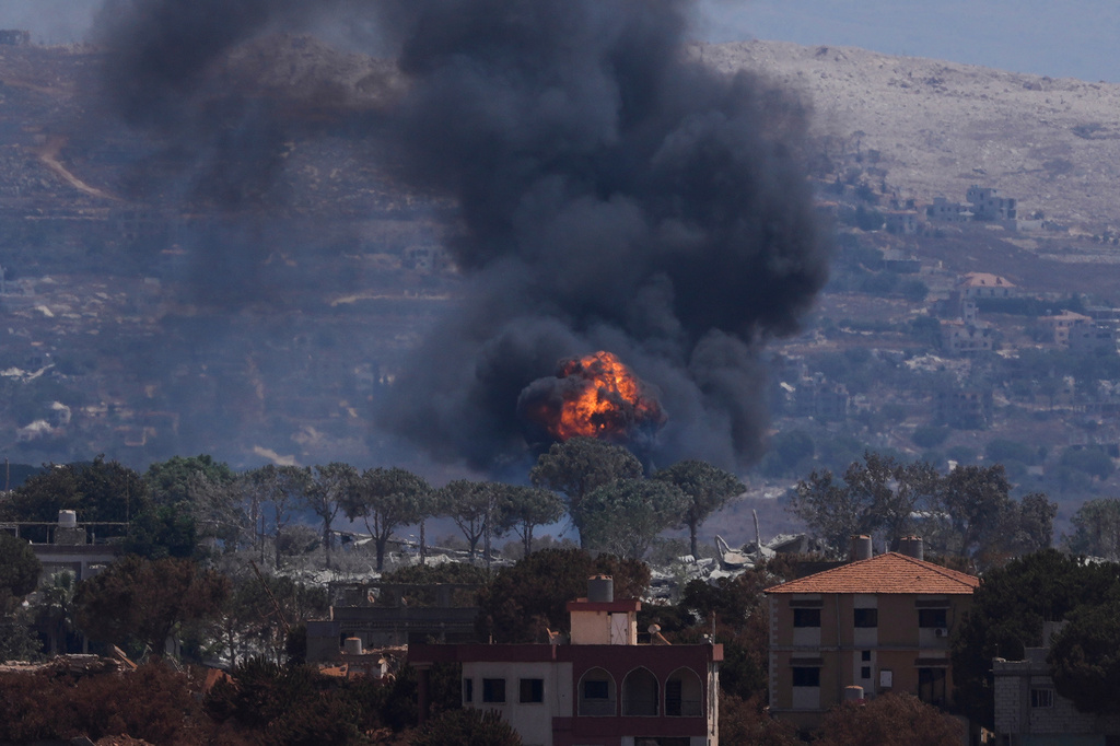 Smoke and flames rise as Israeli forces demolish homes in Zawtar al-Sharqiyah, southern Lebanon, Sunday, Aug. 23, 2026. (AP Photo/Mohammed Zaatari)