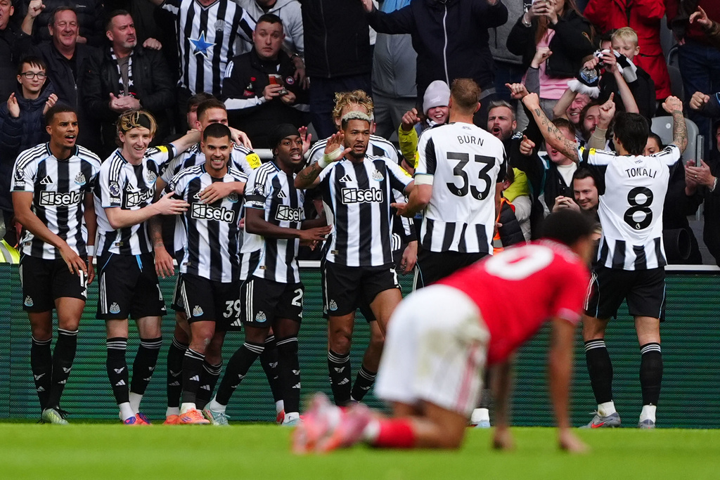Newcastle United's Bruno Guimaraes, 3rd left, celebrates with teammates after scoring their side's first goal of the game during the English Premier League soccer match between Newcastle United and Nottingham Forest at St James' Park, Newcastle-upon-Tyne, England, Sunday Oct. 5, 2025. (Owen Humphreys/PA via AP)