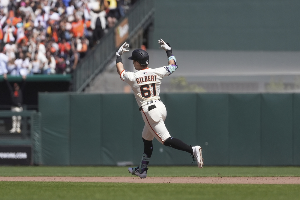San Francisco Giants' Drew Gilbert celebrates after hitting a home run against the Tampa Bay Rays during the seventh inning of a baseball game in San Francisco, Sunday, Aug. 17, 2025. (AP Photo/Jeff Chiu)