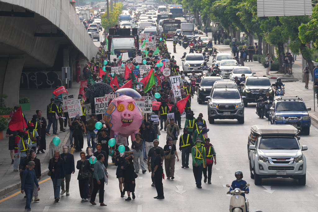 Protesters march to a meeting venue during a demonstration against International Monetary Fund and the World Bank Group in Bangkok, Thailand, Thursday, Oct. 15, 2026. (AP Photo/Sakchai Lalit)