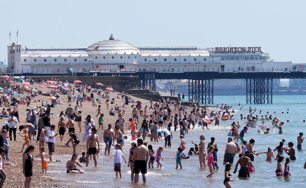 A view of the beach as people enjoy the hot weather in Brighton, East Sussex, England, Tuesday May 26, 2026. (Gareth Fuller/PA via AP)