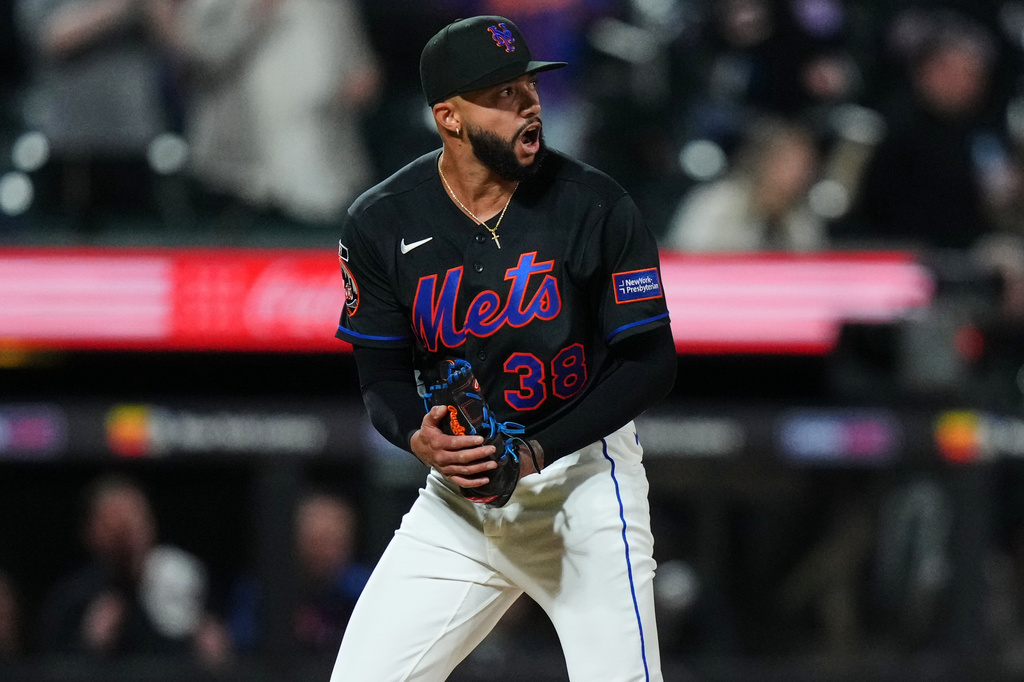New York Mets pitcher Devin Williams reacts after Minnesota Twins' Tristan Gray hit an RBI single during the ninth inning of a baseball game Thursday, April 23, 2026, in New York. (AP Photo/Frank Franklin II)