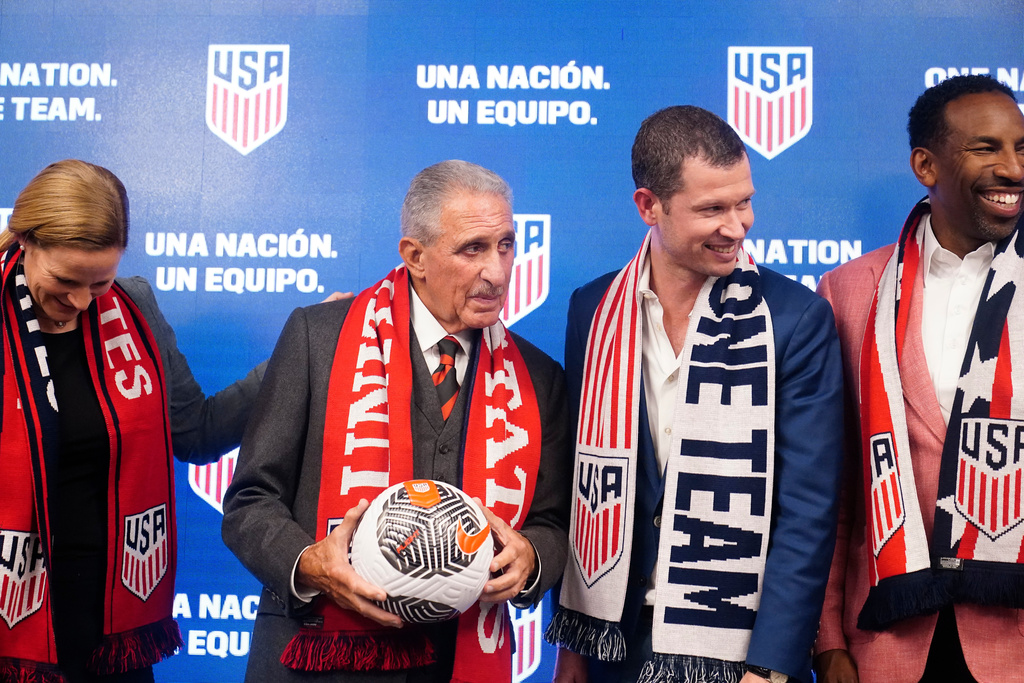 FILE - U.S. Soccer President, Cindy Parlow Cone, Atlanta Business icon and philanthropist, Arthur Blank, JT Batson, U.S. Soccer CEO, and Georgia Mayor, Andre Dickens pose for a portrait after a news conference, Saturday, Sept. 16, 2023, in Atlanta. (AP Photo/Brynn Anderson, File)