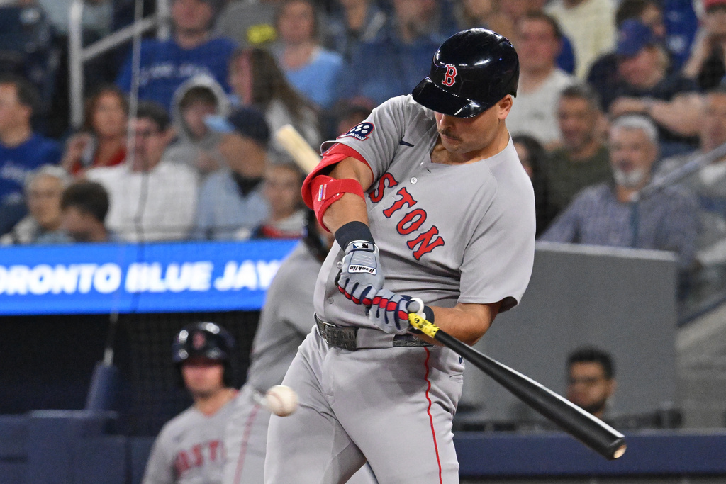 Boston Red Sox's Nathaniel Lowe (37) hits an RBI single against the Toronto Blue Jays in second inning American League baseball action in Toronto on Tuesday, Sept. 23, 2025. (Jon Blacker/The Canadian Press via AP)