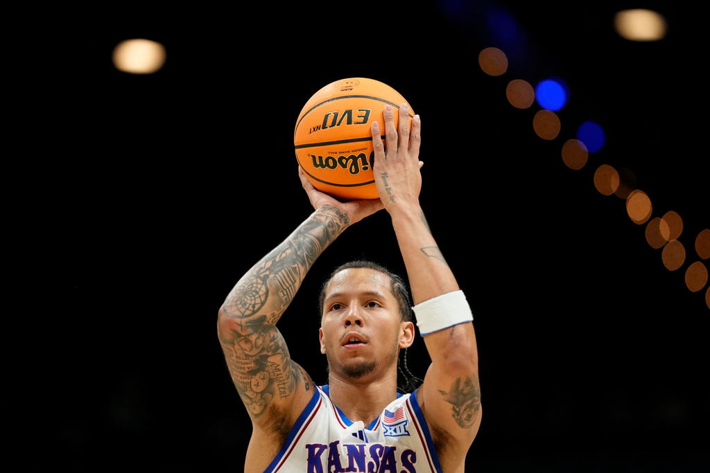 Kansas guard Tre White shoots from the free throw line during the first half of an NCAA college basketball game against Notre Dame, Monday, Nov. 24, 2025, in Las Vegas. (AP Photo/Lucas Peltier)