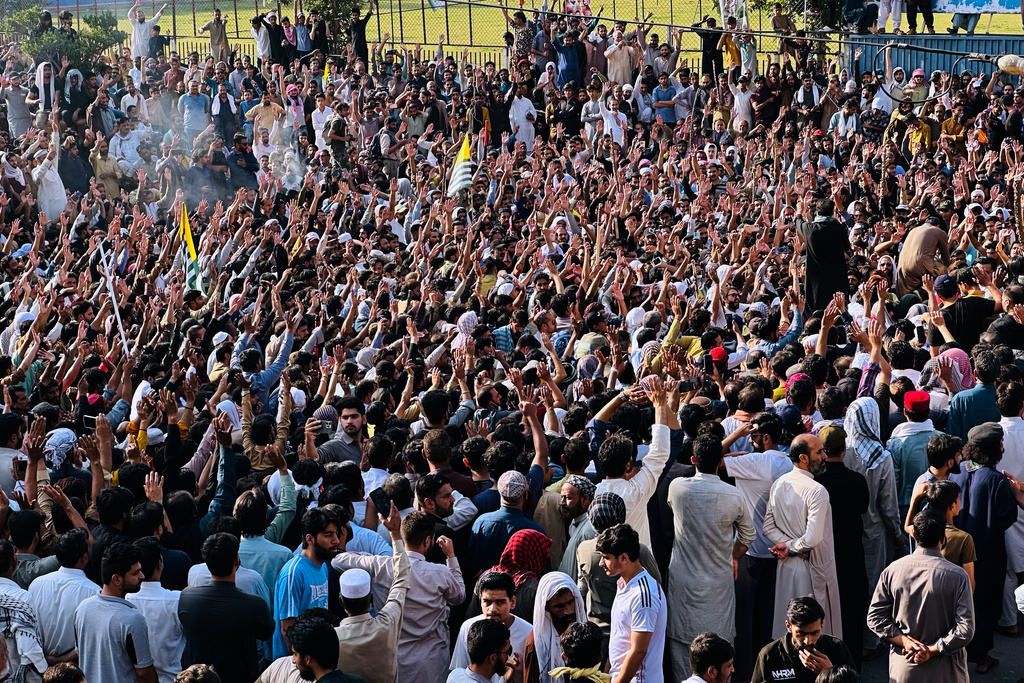 Members of the Awami Action Committee, a civil rights alliance, chant slogans during a rally demanding subsidized food, electricity and other services in Muzaffarabad, the capital of Pakistani controlled Kashmir, Tuesday, Sept. 30, 2025. (AP Photo/M.D. Mughal)