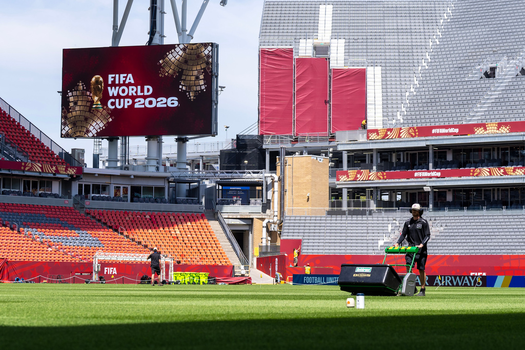 A worker mows the grass at Toronto Stadium, Thursday June 4, 2026, in Toronto, in preparation for World Cup soccer tournament. (Frank Gunn/The Canadian Press via AP)
